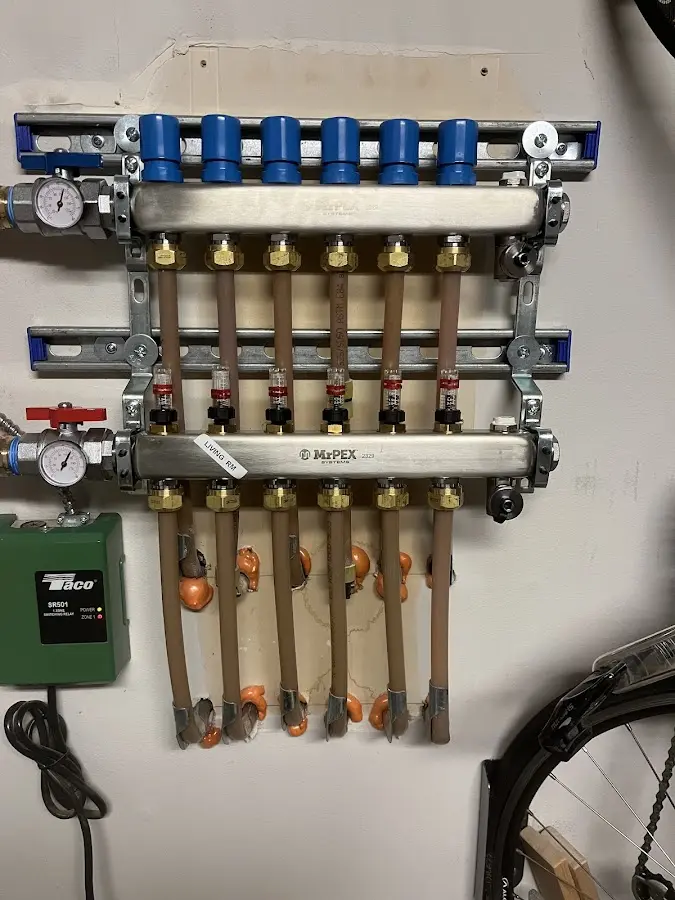 Plumber performing Water Heater Repair at a residential property in Falmouth